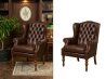 Sillón de cuero marrón recortado con fondo blanco para catálogo de muebles online.